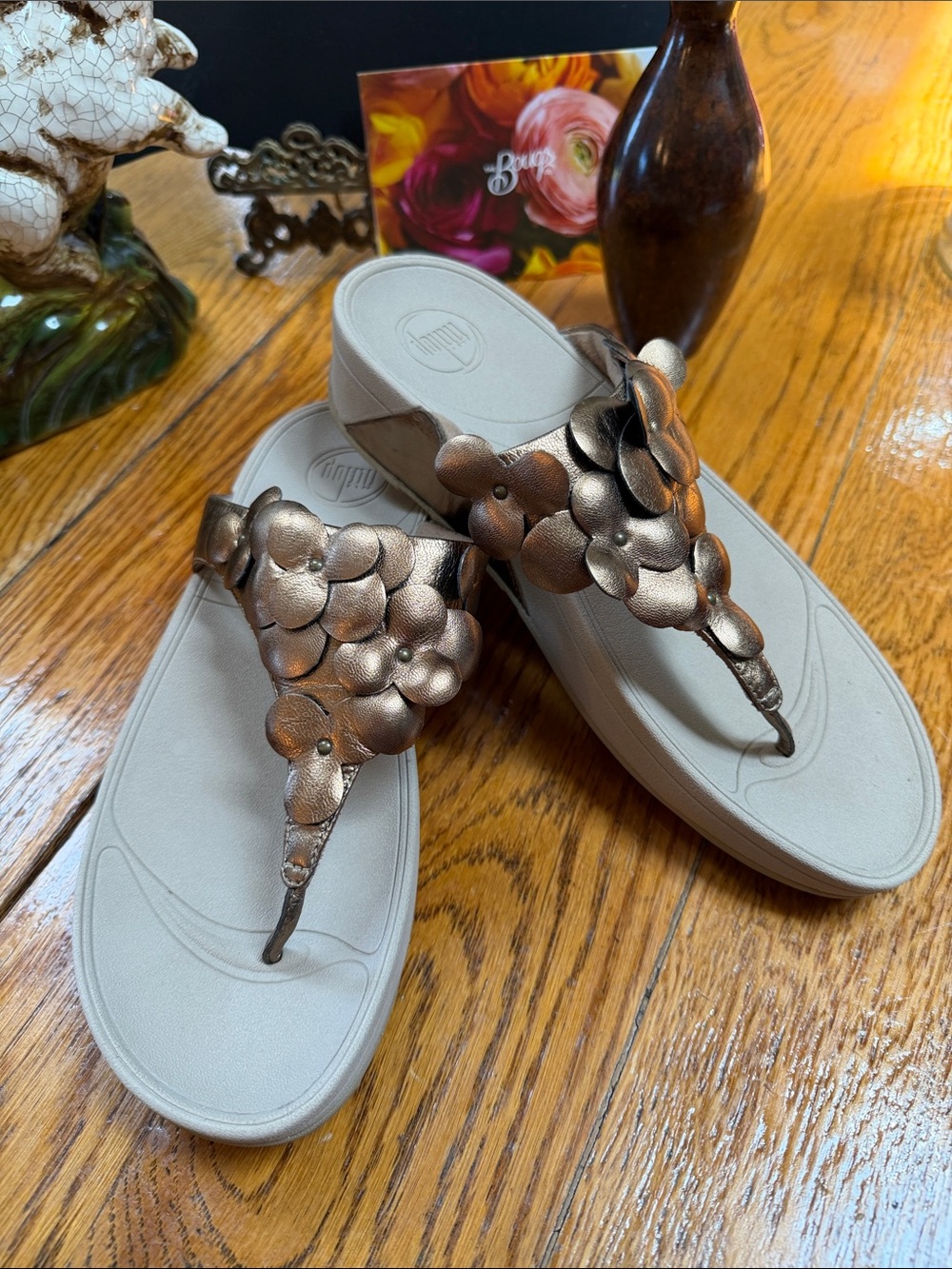 Fitflop Fleur bronze color sandals with floral design on straps. Women’s Size 10
